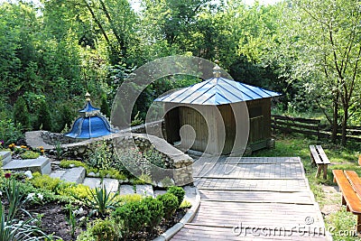 Wooden orthodox chapel built around a spring with water Stock Photo