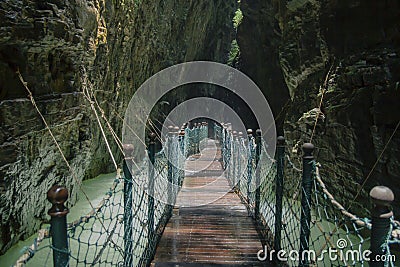 Wooden passage leading to the depths of the valley Stock Photo