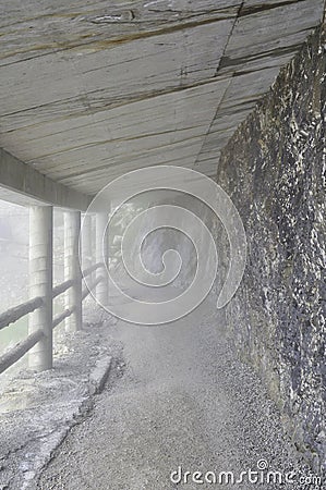 Wooden passage in a rocky foggy landscape Stock Photo