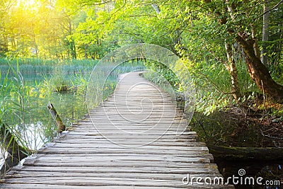 Wooden path across river Stock Photo