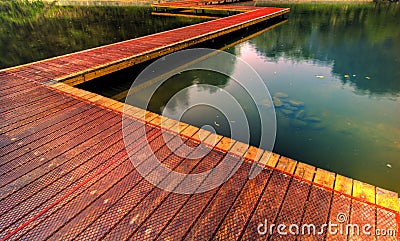 Wooden path by lake Stock Photo