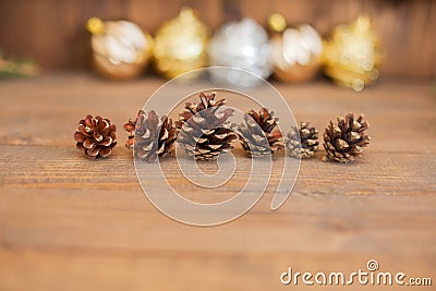 Rustic natural wooden background with pine cones. Stock Photo