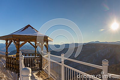 Wooden pavilion with scenery mountains view, Caucasus. Stock Photo