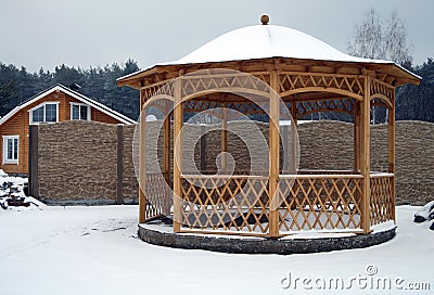 Wooden pavilion in the yard Stock Photo