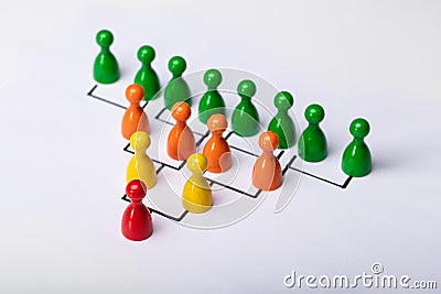 Wooden Pawns Forming Hierarchical Structure Stock Photo
