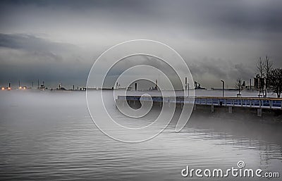 Wooden peer in fog Stock Photo