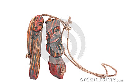 Wooden pendant amulet in the form of an inseparable pair of men Stock Photo