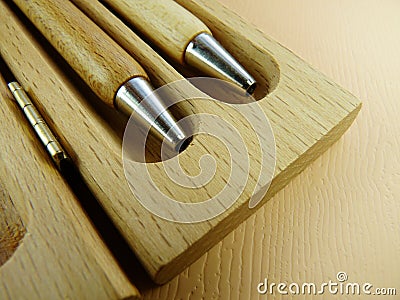 Wooden pens on wooden background Stock Photo