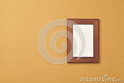 Wooden photo frame on brown background. Top view Stock Photo