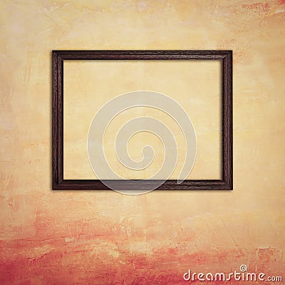 Wooden photo frame on retro yellow concrete wall Stock Photo