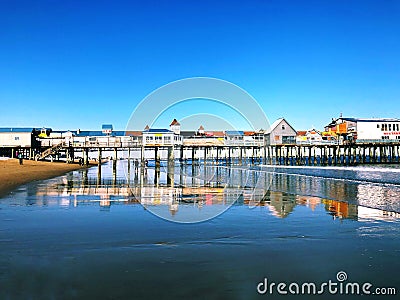 A wooden pier on Old Orchard Beach Editorial Stock Photo