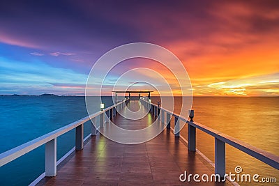 Wooden pier between sunset Stock Photo