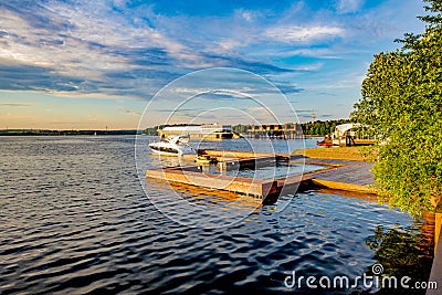 Wooden Pier with yachts preitum ticket office on the banks of the Moscow River Stock Photo