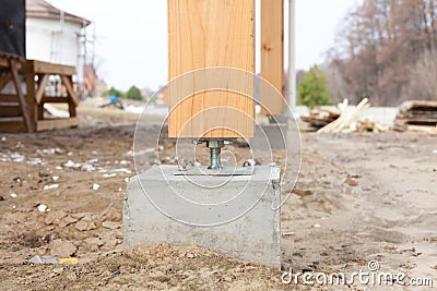 Wooden pillar on the construction site concrete with screw. Wooden Pillars are structures that can be placed on Foundations or Pla Stock Photo