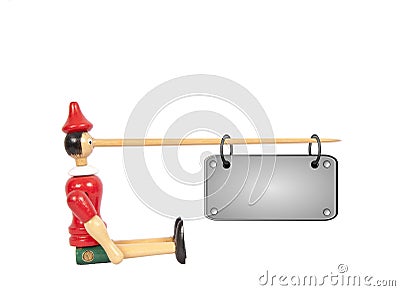 Wooden Pinocchio doll with long nose Stock Photo