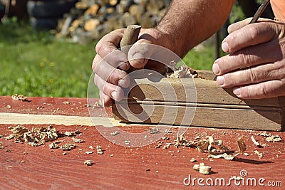 The Wooden planer, table from old wood, a natural building material, handcrafted wood, ancient hand tools, carrying out carpentry, Stock Photo