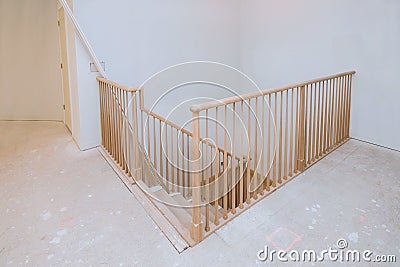 Wooden planks around pole stairs handrails renovation for wooden railing for stairs Stock Photo