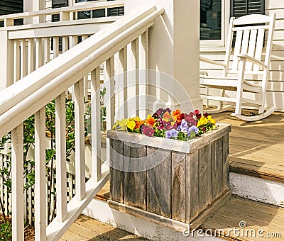 Wooden planter with pansies on stairway, Spring Stock Photo