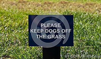 Please Keep Dogs Off The Grass sign Stock Photo
