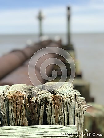 Wooden pole at the beach Stock Photo