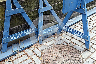 Wooden police barrier with white stenciled lettering Stock Photo