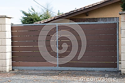 Wooden portal steel sliding plank gate design modern style street view outdoor Stock Photo