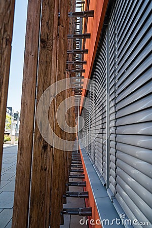 Wooden profiles lattice in modern architecture building Stock Photo