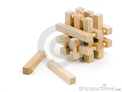 Wooden Puzzle with Two Pulled Pieces Stock Photo