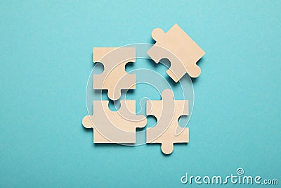 Wooden puzzles, solving problems in business. Innovation and teamwork in company Stock Photo