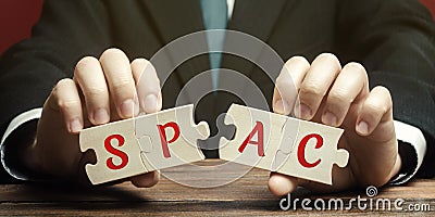 Wooden puzzless with the word SPAC - Special purpose acquisition company. Simplified listing of company, merger bypassing stock Stock Photo