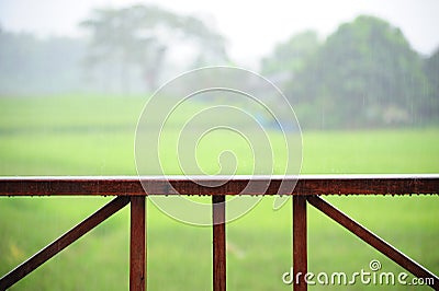 Wooden rail of hose terrace in raining Stock Photo