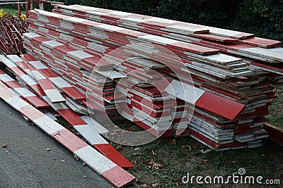 Wooden red and white barrier planks on a building or construction site of civil engineering Stock Photo