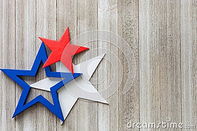 Wooden red, white and blue stars on a rustic background with copy space/4th of July background concept Stock Photo