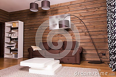 Wooden room interior with couch and table Stock Photo