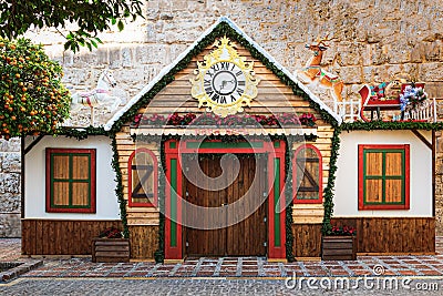 Wooden Santa Claus house with deer on the roof. Building is placed in centre of Marbella town. Editorial Stock Photo