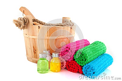 Wooden sauna bucket with colorful towels and soap Stock Photo