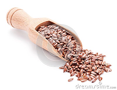 Wooden scoop with flax seeds on white Stock Photo