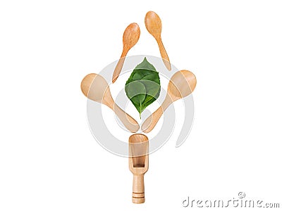 Wooden scoop and spoon and green leaf, natural wooden utensils Eco-environmentally friendly Stock Photo