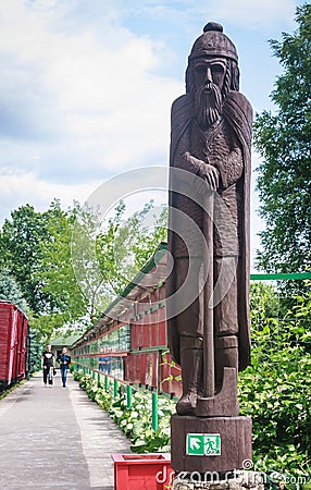 Wooden sculpture at the entrance to the park Grutas Editorial Stock Photo