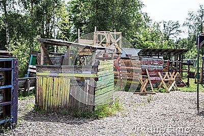 Wooden shack and signpost on adventure playground Stock Photo