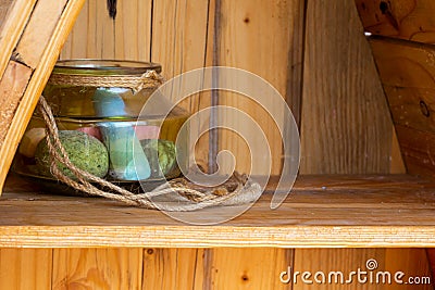 Decoration glass jar on wooden shelf Stock Photo