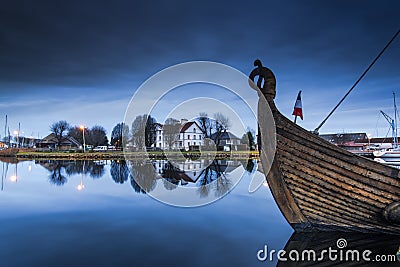 Wooden ship in Carentan quay with reflections in water Editorial Stock Photo