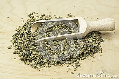 Wooden shovel with dried holy thistle Stock Photo