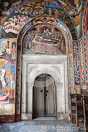 Door and frescoes of main church, Rila Monastery, Bulgaria Editorial Stock Photo