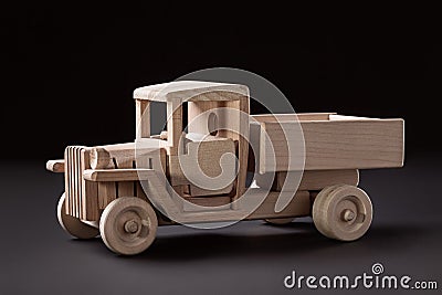 Wooden side view of a truck on a black background. Stock Photo