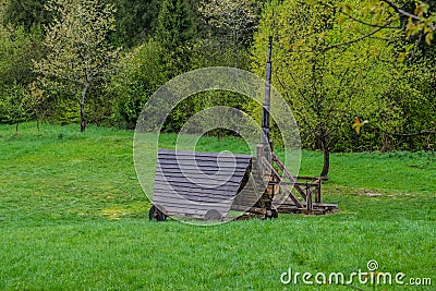 Wooden siege weapons, battering ram and trebuchet Editorial Stock Photo