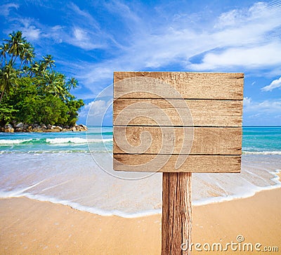 Wooden signboard on tropical beach Stock Photo