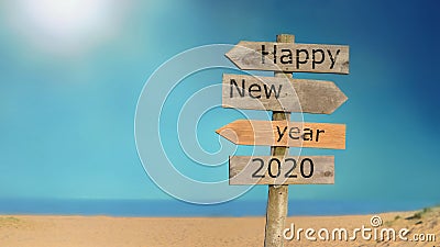 Signpost happy new year 2020 on the sky and beach Stock Photo