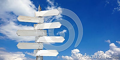 Wooden signpost with many clear arrows Stock Photo