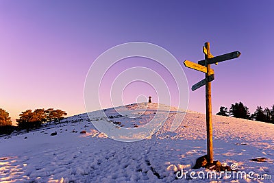 Wooden signpost in Saibi at winter Stock Photo